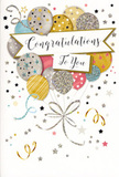 This image shows an elegant congratulations card that feels like a moment of celebration captured in paper, the sort you might choose to accompany a bouquet delivered across Longford. The design centres on a generous cluster of balloons rendered in gentle metallic tones-antique gold, soft silver, champagne, blush pink, misty grey and delicate sky blue-each balloon distinct in its decoration. Some are wrapped with fine, shimmering stripes, while others are dotted with tiny stars or dusted with glitter, giving the effect of soft light playing across foil and satin textures. Their ribbons fall in sweeping curls of gold and silver, crossing and looping gracefully, much like the trailing foliage in a carefully composed floral design. Floating through the middle is a curved banner, creamy and calm, carrying the words Congratulations To You in an elegant, looping script that conveys sincere pride and warmth. Around the edges, small stars, confetti specks and spiralling lines drift across a pale backdrop, suggesting the carefree energy of a shared celebration after good news has spread along Bath Road or through nearby neighbourhoods. The finish of the card appears subtly embossed, with glimmering accents you could almost feel beneath your fingertips, enhancing the sense of quality and care. Overall, the image conveys a mood of radiant joy and dignified achievement, perfectly suited to graduations, exam results, new jobs or any milestone where a thoughtful card and fresh flowers from a local Longford florist can make the moment feel truly special.